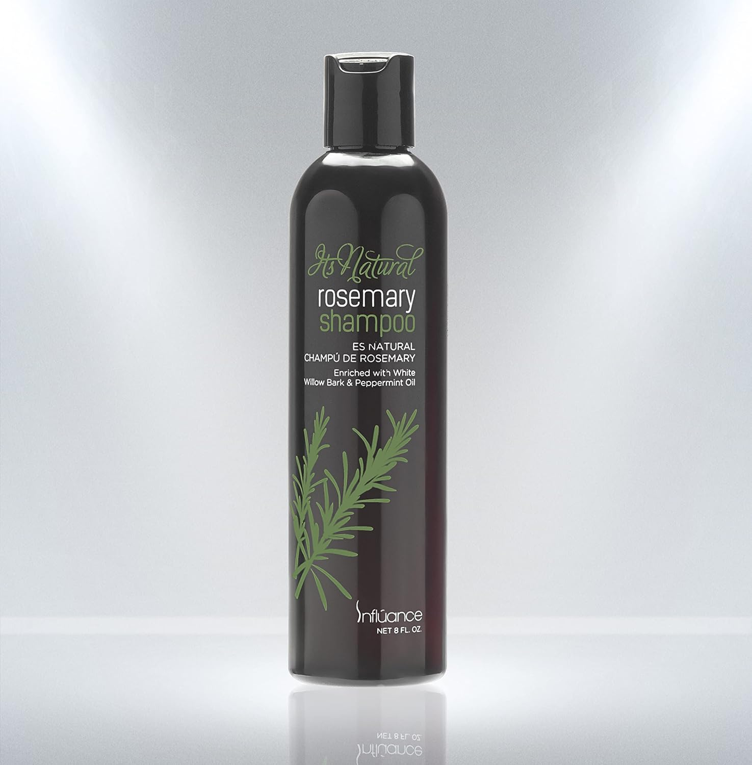Bottle of Jo Naturel rosemary shampoo on a gray background